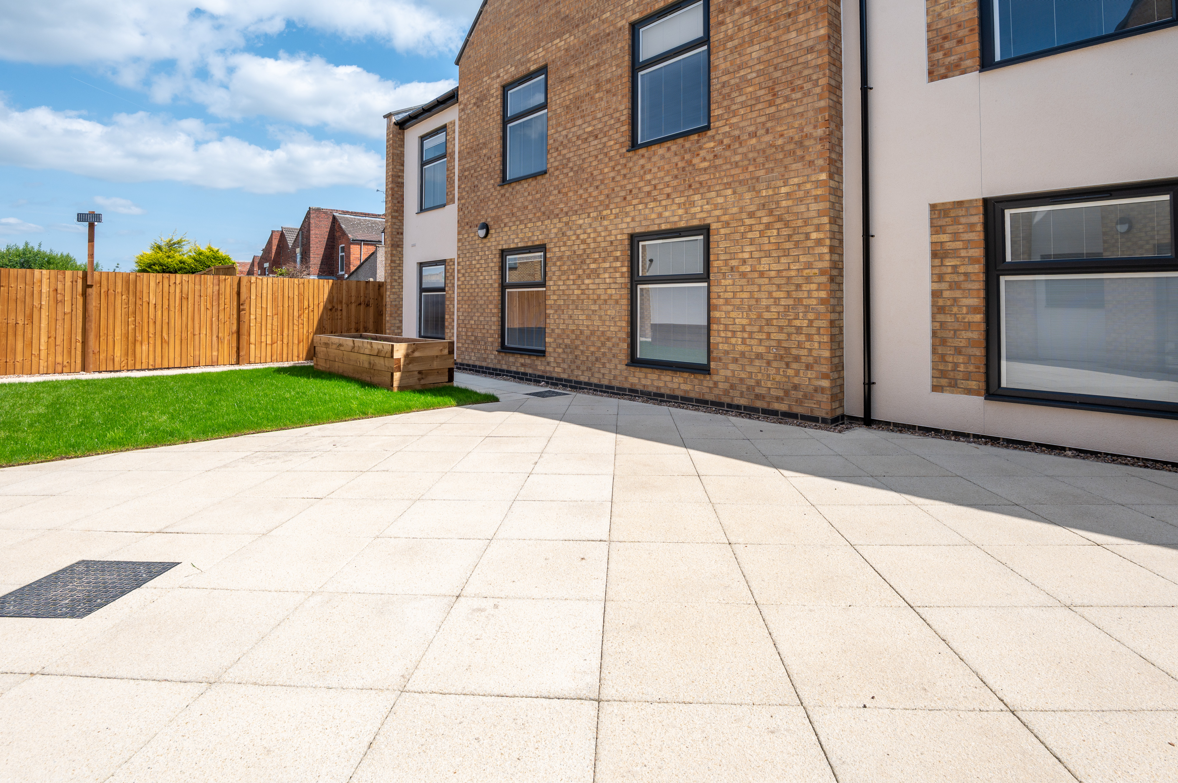 Bounded by the building and a secure perimeter with glazed doors linking the garden to communal spaces